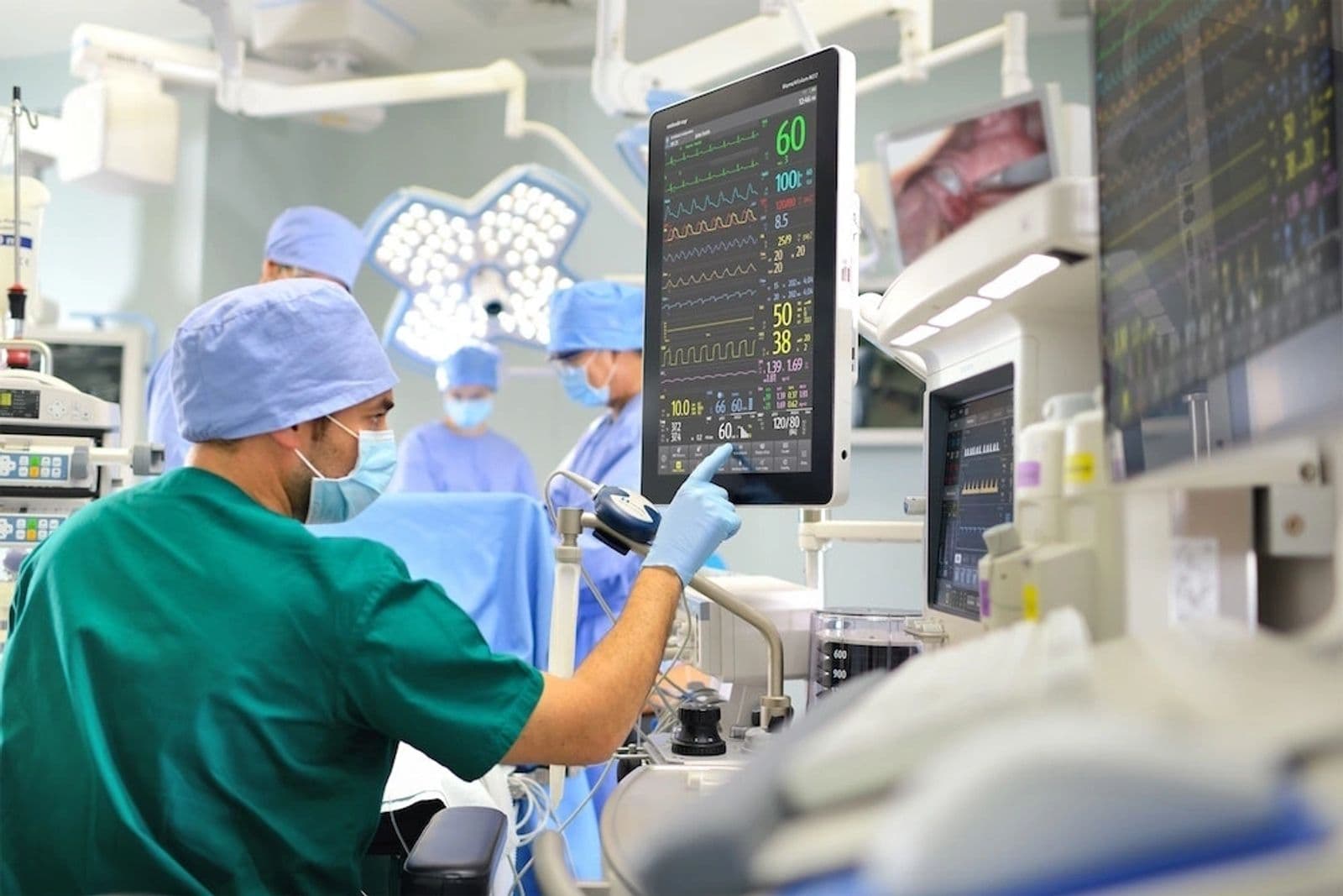 Medical wire harness in hospital room with monitor and equipment.